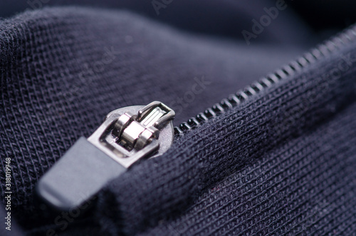 Black fabric cloth material zipper macro blur background