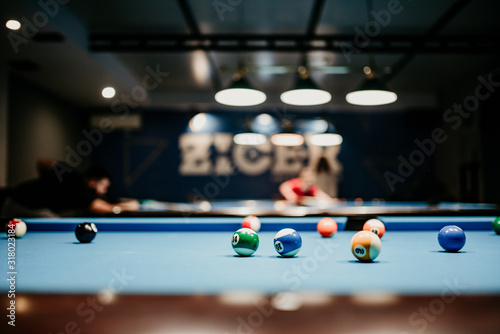  Pool balls on a blue pool table 
