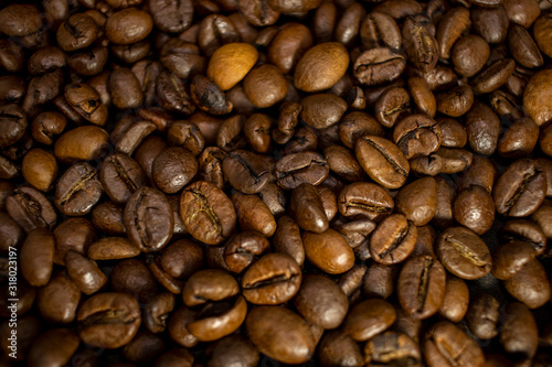 Dark background and texture of coffee beans  selective focus  closeup grains.