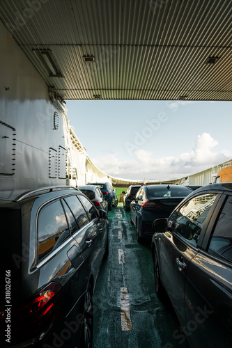 Fototapeta Naklejka Na Ścianę i Meble -  Cars being transported on one of the car ferry between Mortavika and Arsvågen, Norway