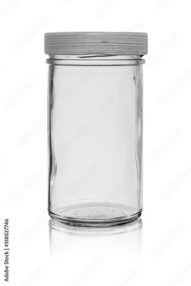 Empty glass jar with a lid. Isolated on a white background with reflection Empty glass jar with a lid. Isolated on a white background with reflection