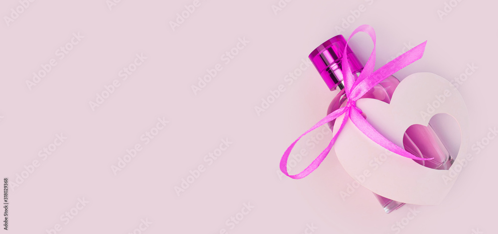 Valentines Day creative concept flat lay. Gift mockup, purple perfume bottle, ribbon heart card tag on white background. Top view copy space.8 march female present, web site header, advertising banner