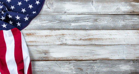 Waving United States Flag on white rustic wood Background for Memorial, Independence, Veteran or Labor day holiday concept 