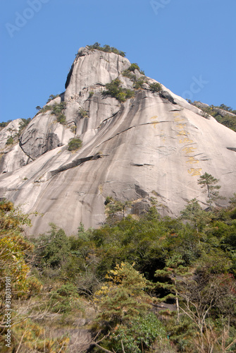 Huangshan Mountain in Anhui Province, China. Chinese characters written on a cliff seen from the Western Path that ascends the mountain to Yuping Hotel. Scenic view on Huangshan Mountain, China. photo