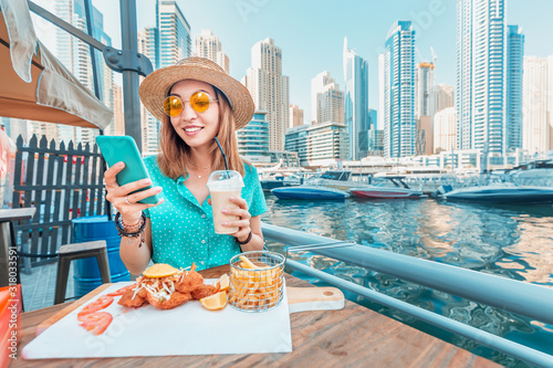 Photography Asian girl has Breakfast with seafood cuisine in a restaurant on the terrace ove