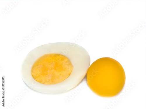 the egg s half and a yolk isolated on a white background