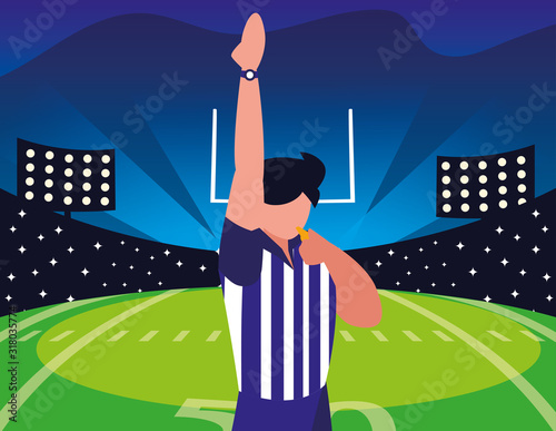 american football referee with his hand up on stadium