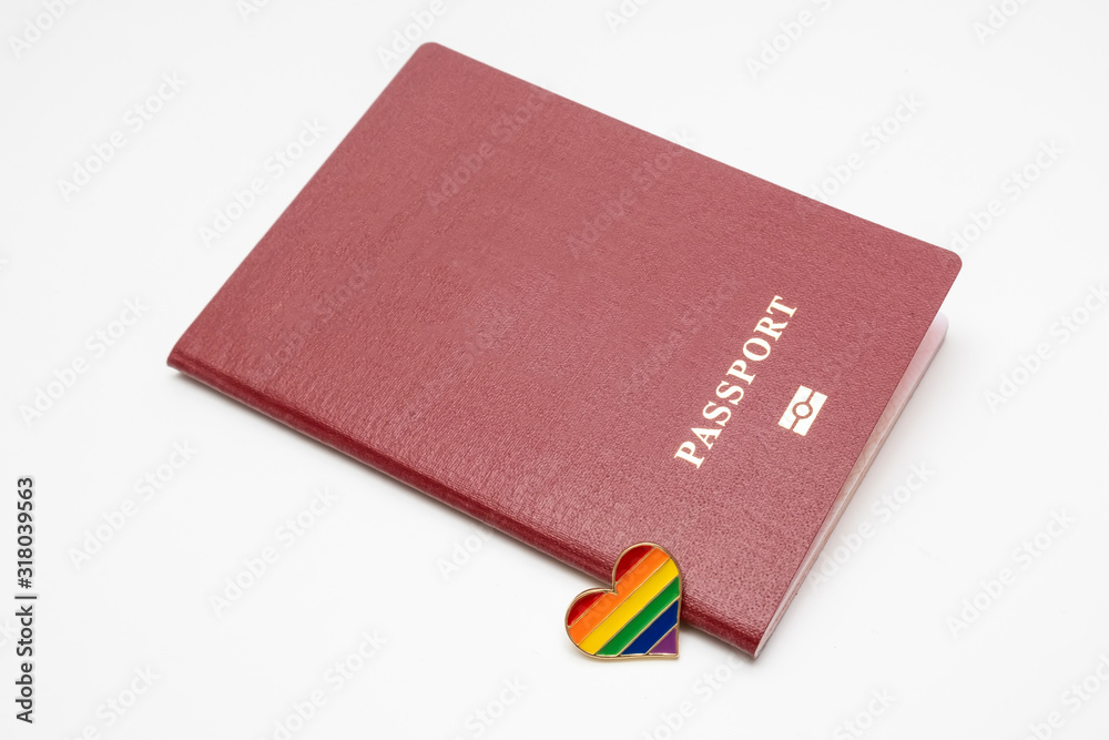 lgbt rights and searching for asylum and migration concept, and rainbow gay pride symbol heart and red passport on white background lgbt rights and searching for asylum and migration concept, and rainbow gay pride symbol heart and red passport on white background