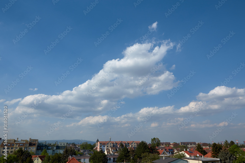 Cityscape with blue sky and clouds