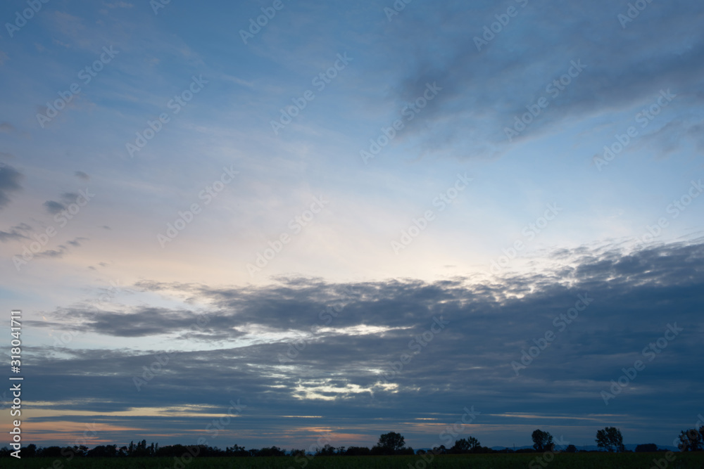 Panorama of evenning cloudy sky.