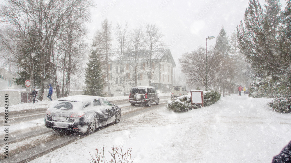 Fototapeta premium extreme snowfall with cars coverd with a lot of snow in Europe, Slovakia, mountain district