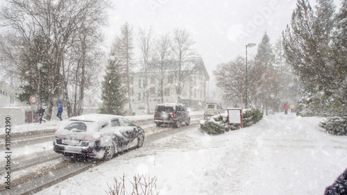 extreme snowfall with cars coverd with a lot of snow in Europe, Slovakia, mountain district