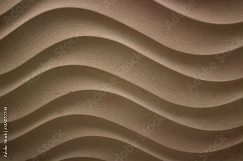 waves as abstract texture for wallpaper or background in brown