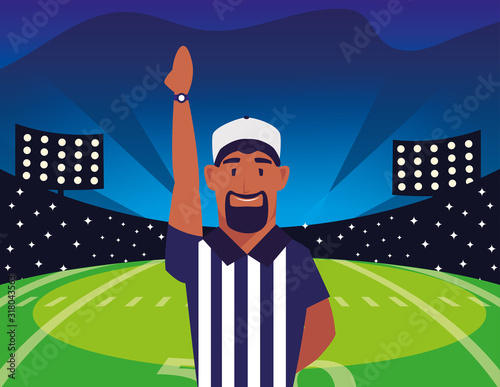 american football referee with his hand up on stadium