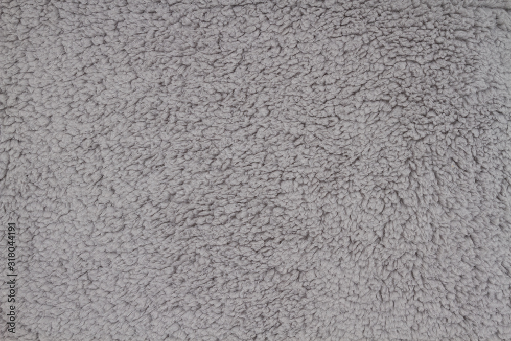 Gray sherpa textured plush fabric material background Gray sherpa textured plush fabric material background