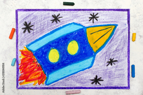 Photo of colorful drawing: blue space rocket in cosmos