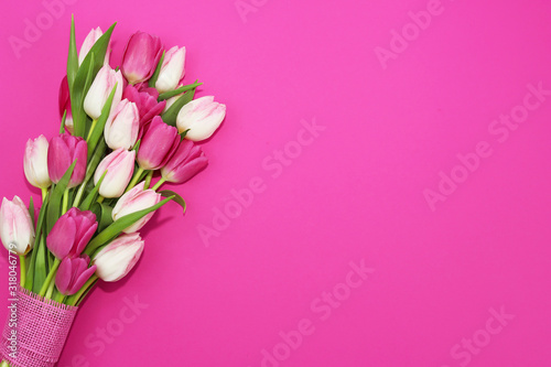 Fototapeta Naklejka Na Ścianę i Meble -  Bouquet of beautiful tulips on pink background.