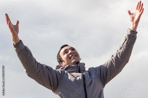  happiness young man with arms raised