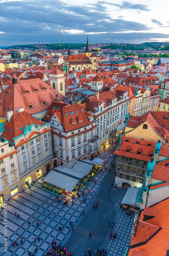 Naklejka premium Top vertical view of Prague Old Town (Stare Mesto) historical city centre with red tiled roof buildings on Old Town Square (Staromestske namesti) in evening sunset, Bohemia, Czech Republic.