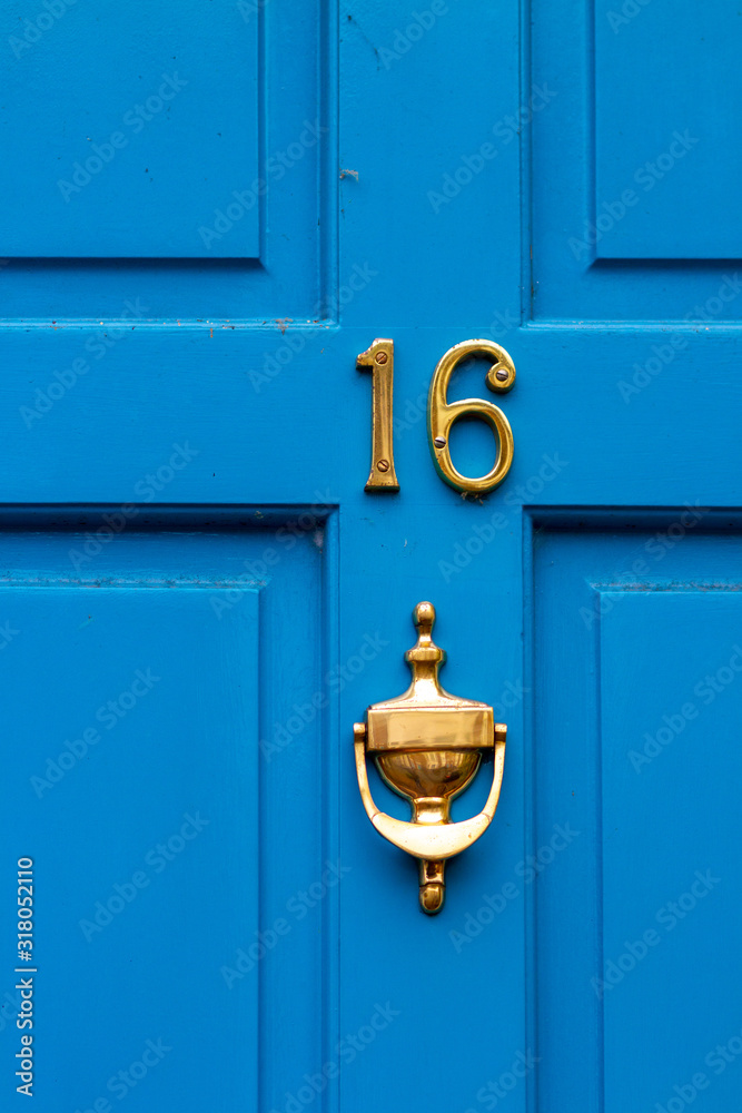 House number 16 with ornate door knocker House number 16 with ornate door knocker