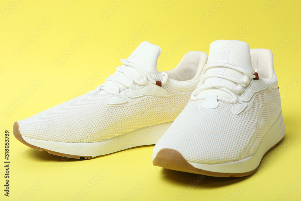 men's sneakers on a colored background. men's footwear. minimalism men's sneakers on a colored background. men's footwear. minimalism