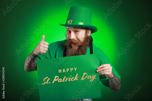 Bearded man holding poster ...