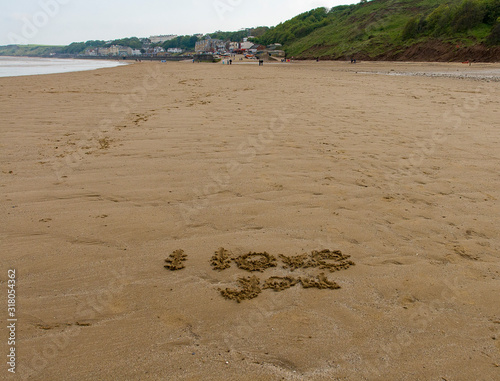 "I love you" written in the sand