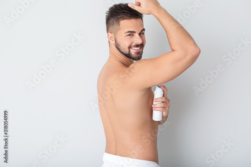 Handsome young man using de...