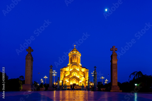 The Cathedral of the Holy Trinity or tsminda Sameba (translated as the Holy Trinity). Night photo, lights, moon over the Cathedral