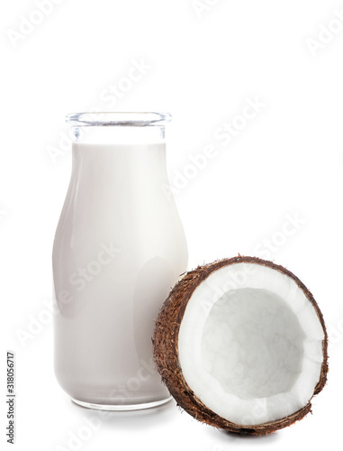 Bottle of tasty coconut milk on white background