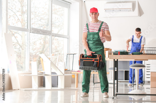 Portrait of furniture assembler in workshop