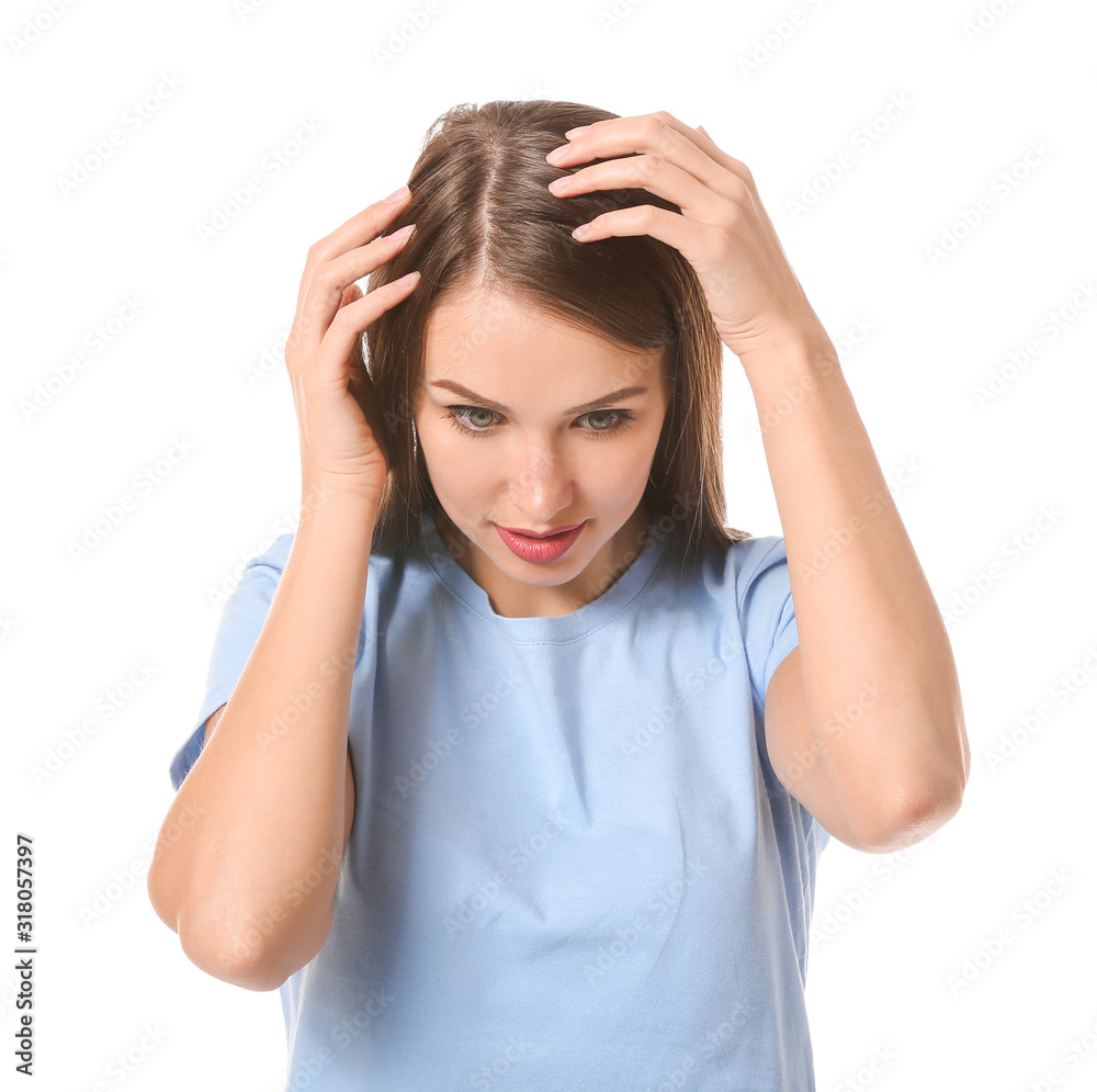 Young woman with hair loss problem on white background Young woman with hair loss problem on white background