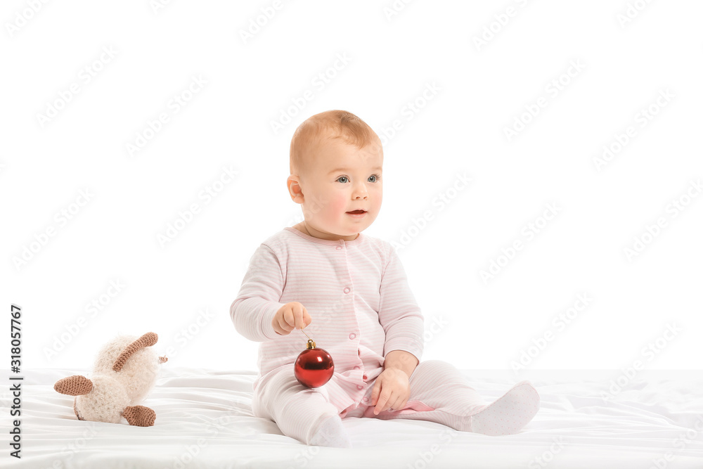 Cute little baby with Christmas ball and toy on white background Cute little baby with Christmas ball and toy on white background