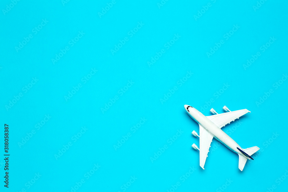 Travel minimal background. Model airplane in flight on an empty colored background. Copy space Travel minimal background. Model airplane in flight on an empty colored background. Copy space