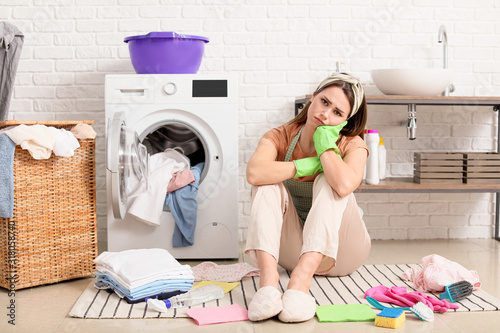 Tired young housewife with ...