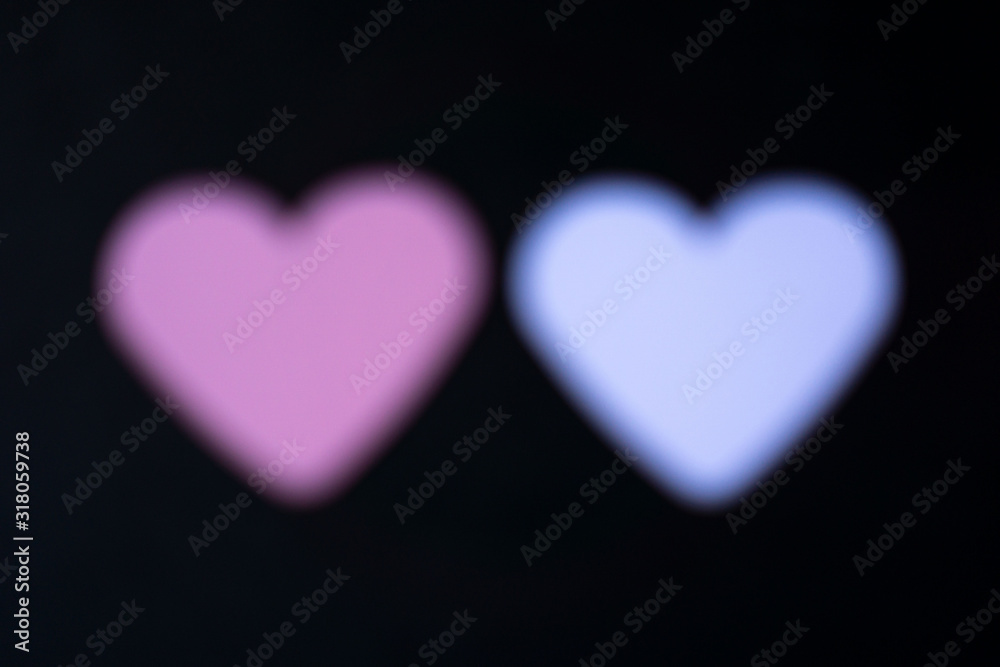 Fototapeta premium a blurry white and pink heart in front of a black background
