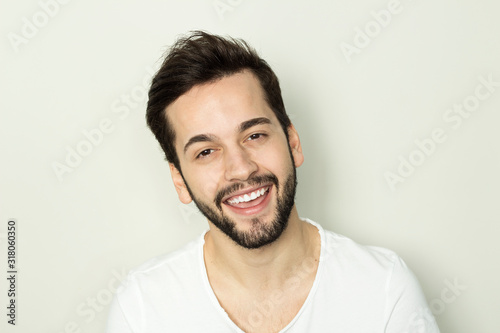 Handsome smiling man with white teeth