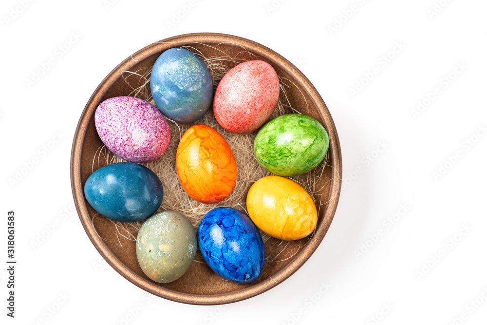 Different easter eggs in ceramic bowl isolated on white Different easter eggs in ceramic bowl isolated on white