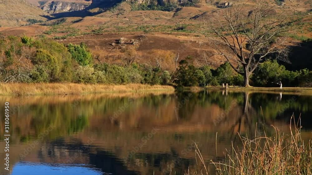 Drakensberg mountains with symmetrical reflection in water, Royal Natal National Park, South Africa Drakensberg mountains with symmetrical reflection in water, Royal Natal National Park, South Africa