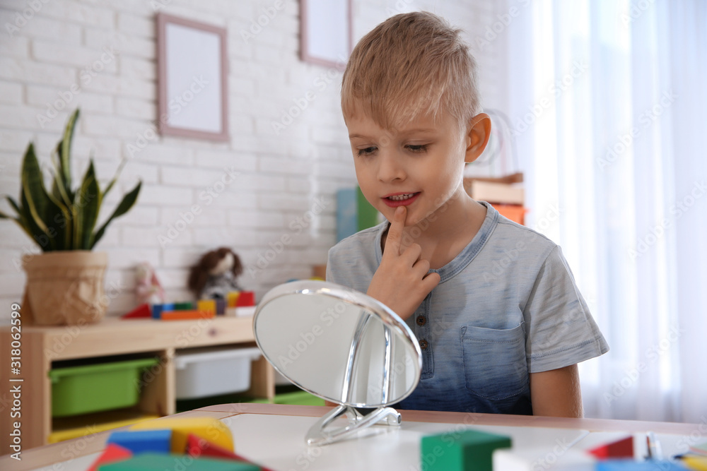 Cute little boy at speech therapist office