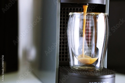 Coffee time in office. Capsule espresso in double glass cup - 100  arabica