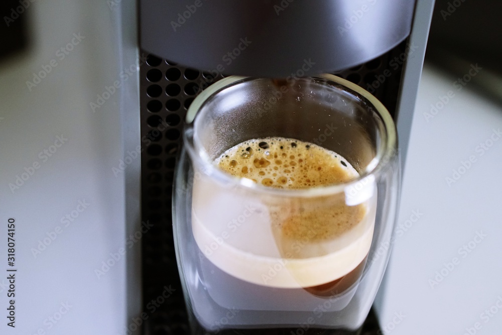 Coffee time in office. Capsule espresso in double glass cup - 100% arabica Coffee time in office. Capsule espresso in double glass cup - 100% arabica