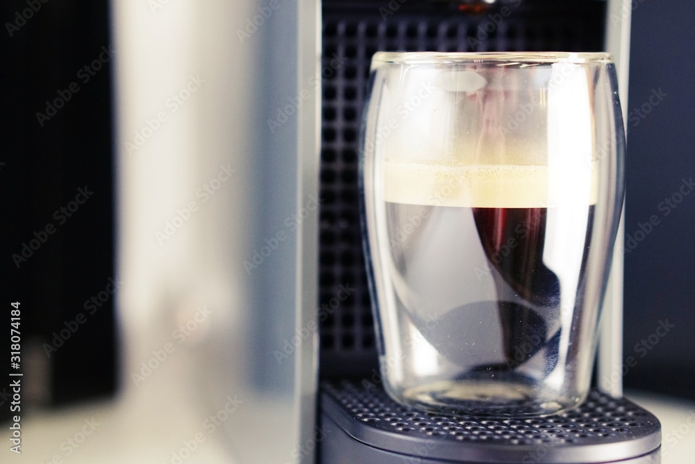 Coffee time in office. Capsule espresso in double glass cup - 100% arabica Coffee time in office. Capsule espresso in double glass cup - 100% arabica