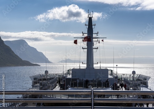 Closeup shot of a white battlecruiser on the shore on a sunny day in Alesund, No Fototapet