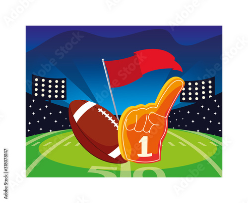 american football ball with hand glove on stadium grass