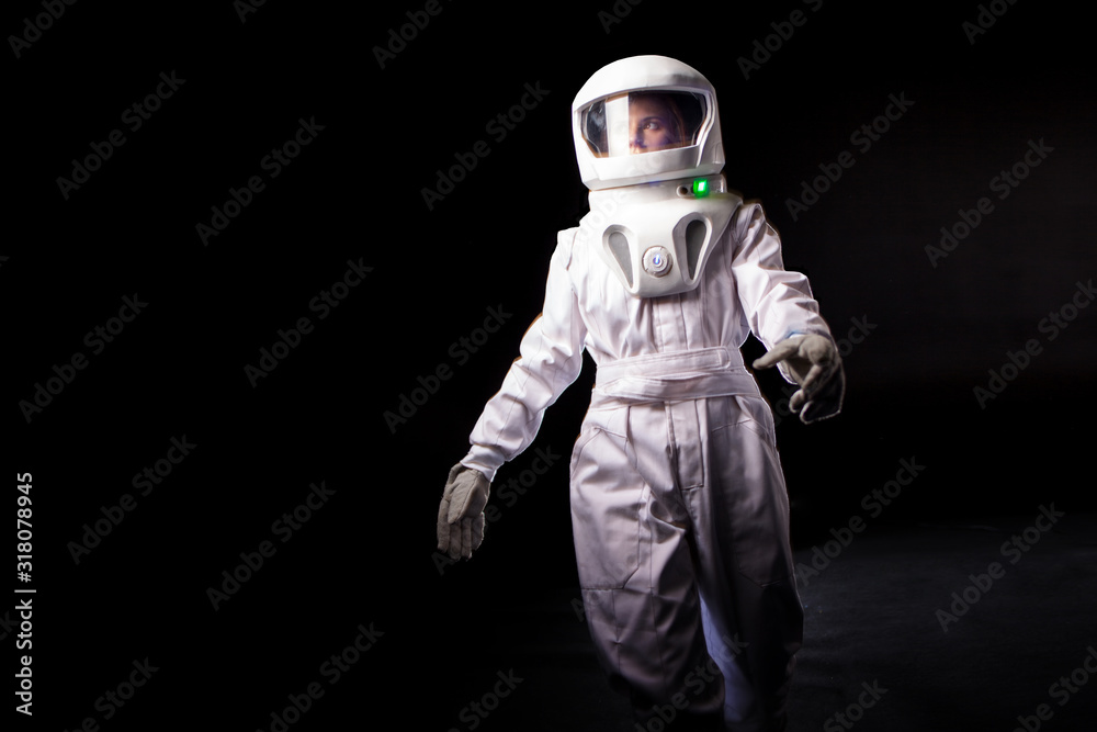Astronaut on a black background. astronaut in a spacesuit Astronaut on a black background. astronaut in a spacesuit