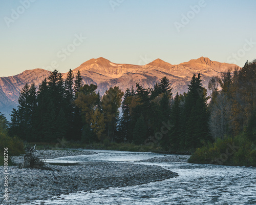 Snake River in Jackson, Wyoming with mountains in the background. photo