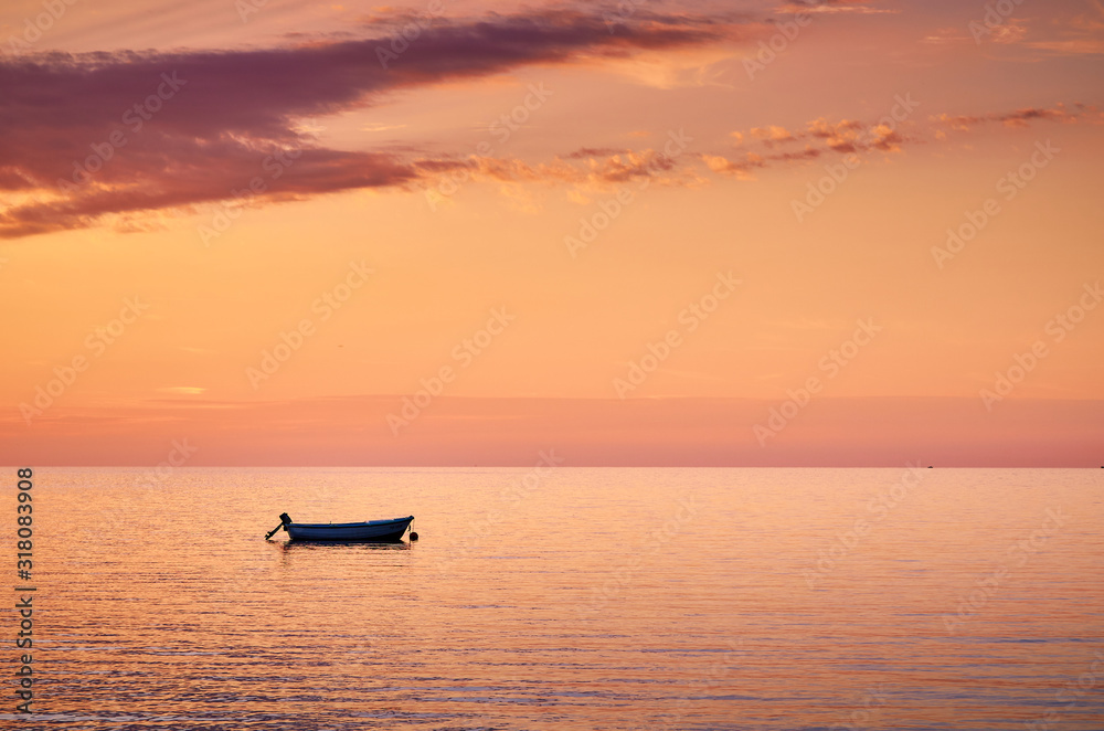 Fototapeta premium boat at sunset