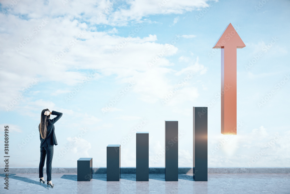 Young businesswoman looking on stock chart