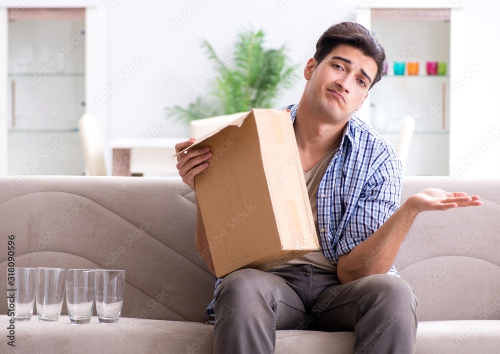 Man receiving wrong parcel with glasses Man receiving wrong parcel with glasses